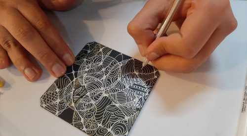 Woman doing Zenrangle art